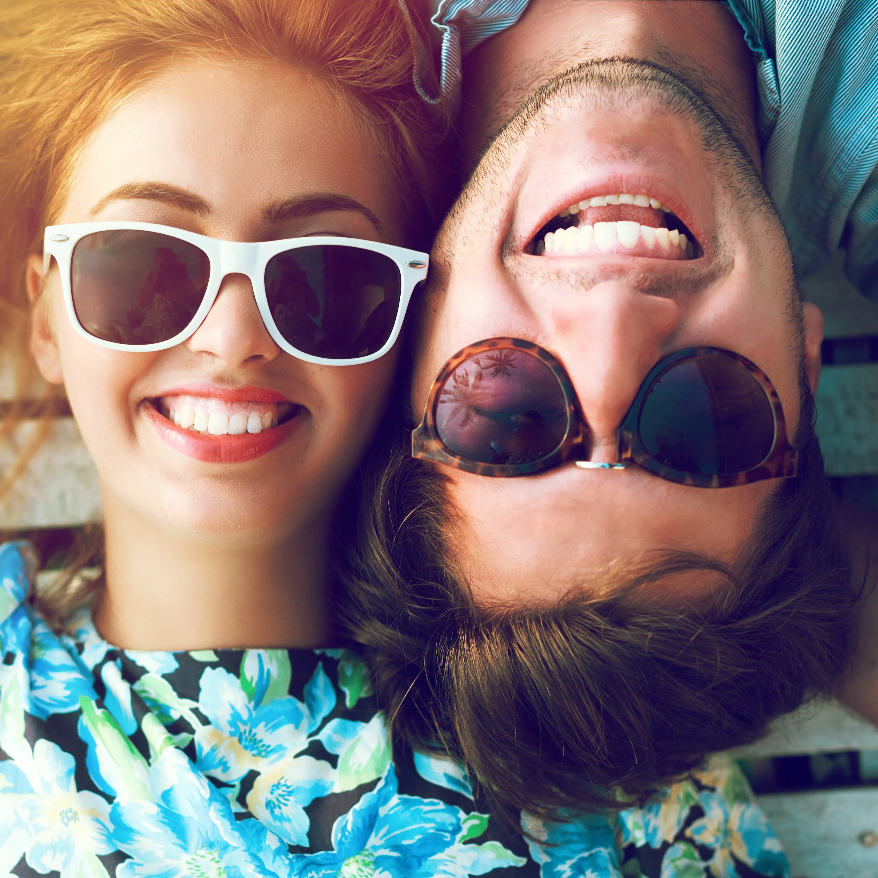 Smiling couple enjoying healthy smiles after visiting Hausten Dental
