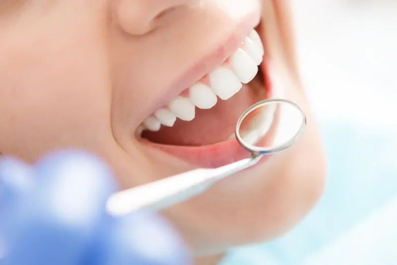 Woman smiling after cosmetic dentistry treatment